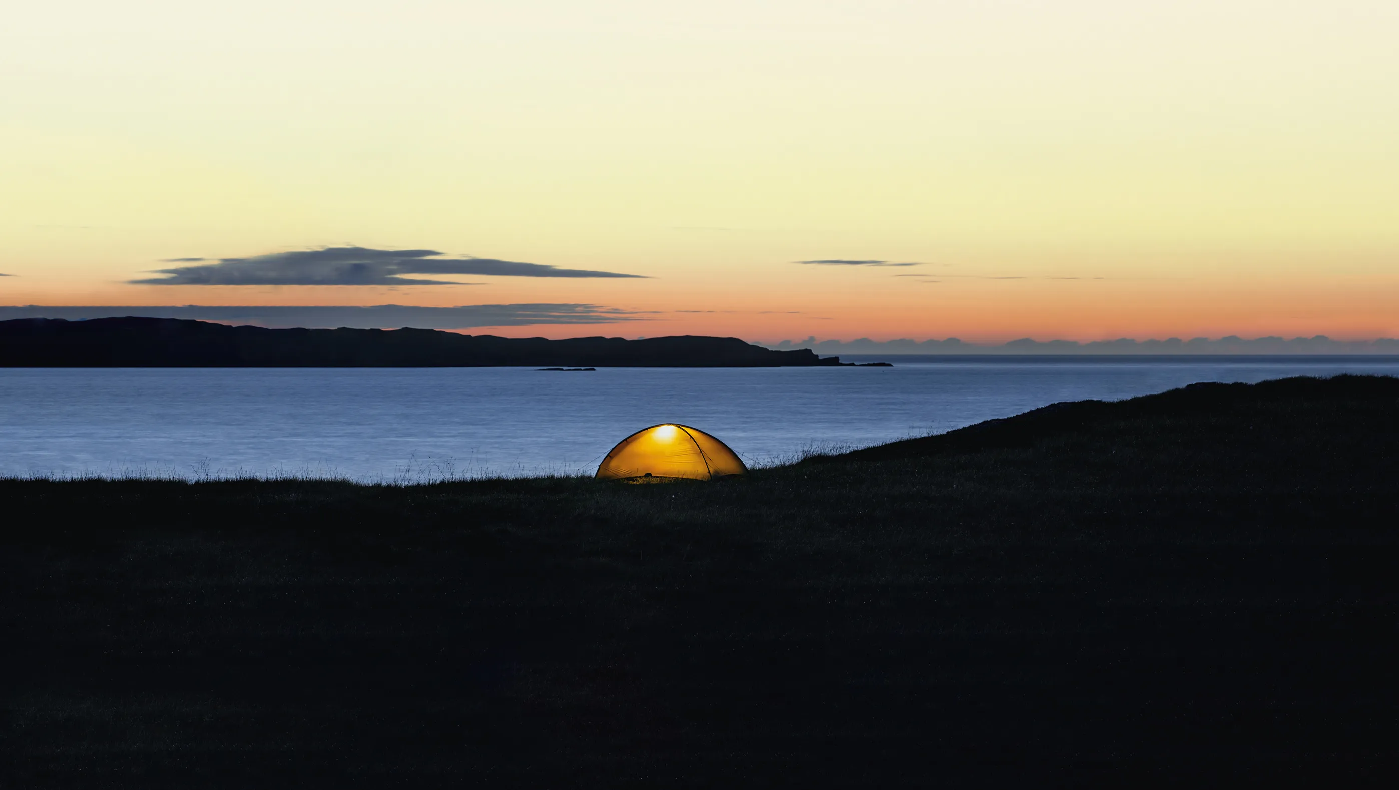 A Hilleberg tent next to the ocean
